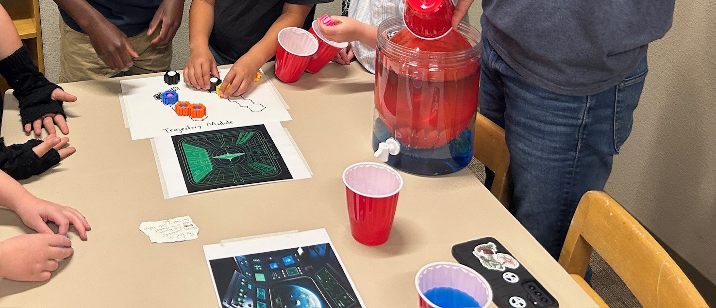 Hands on the Trajectory Module puzzle in the How to Land a Spaceship escape room
