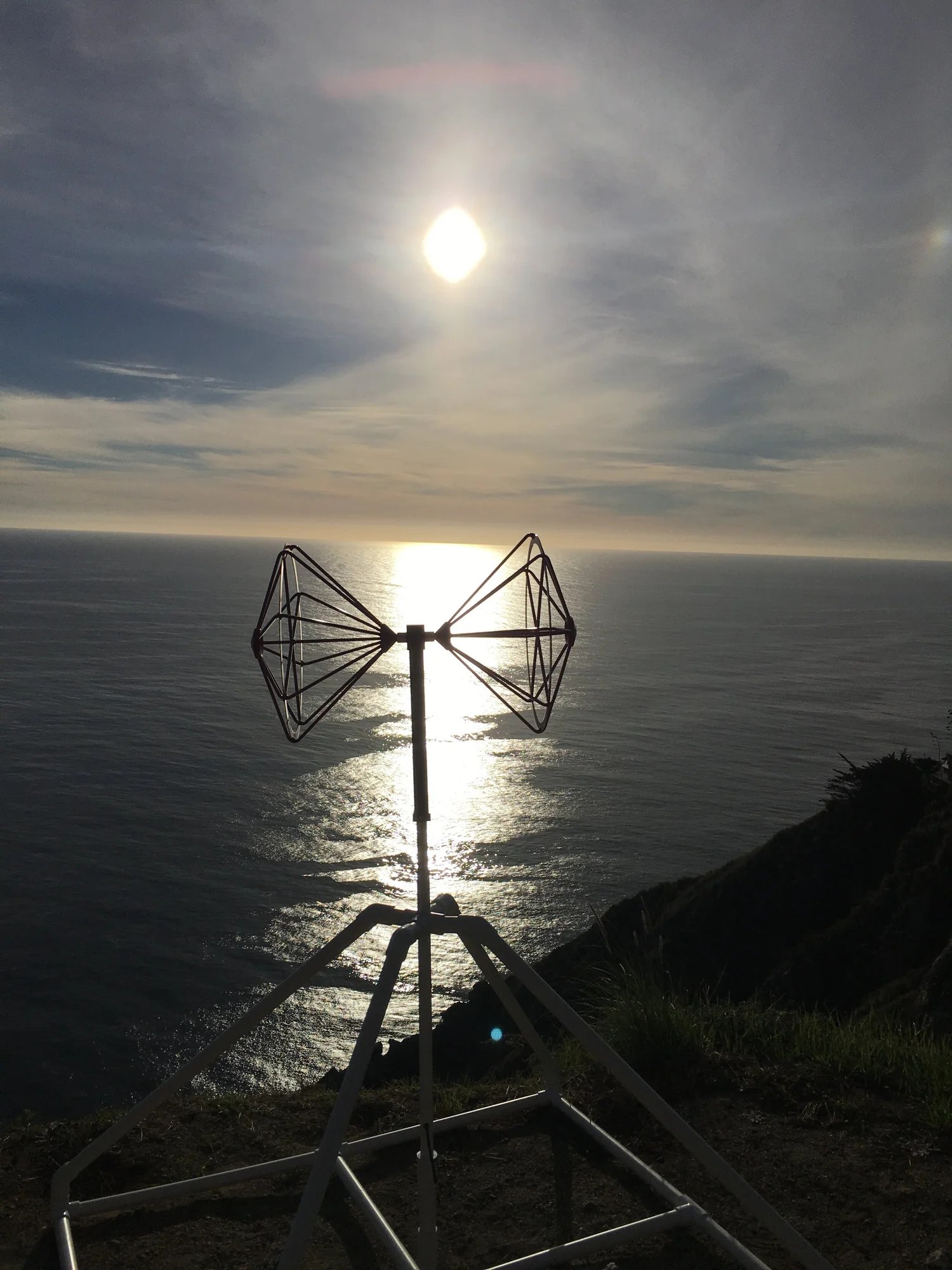 A radar antenna on a cliff over the ocean, from the Radio Glaciology Lab