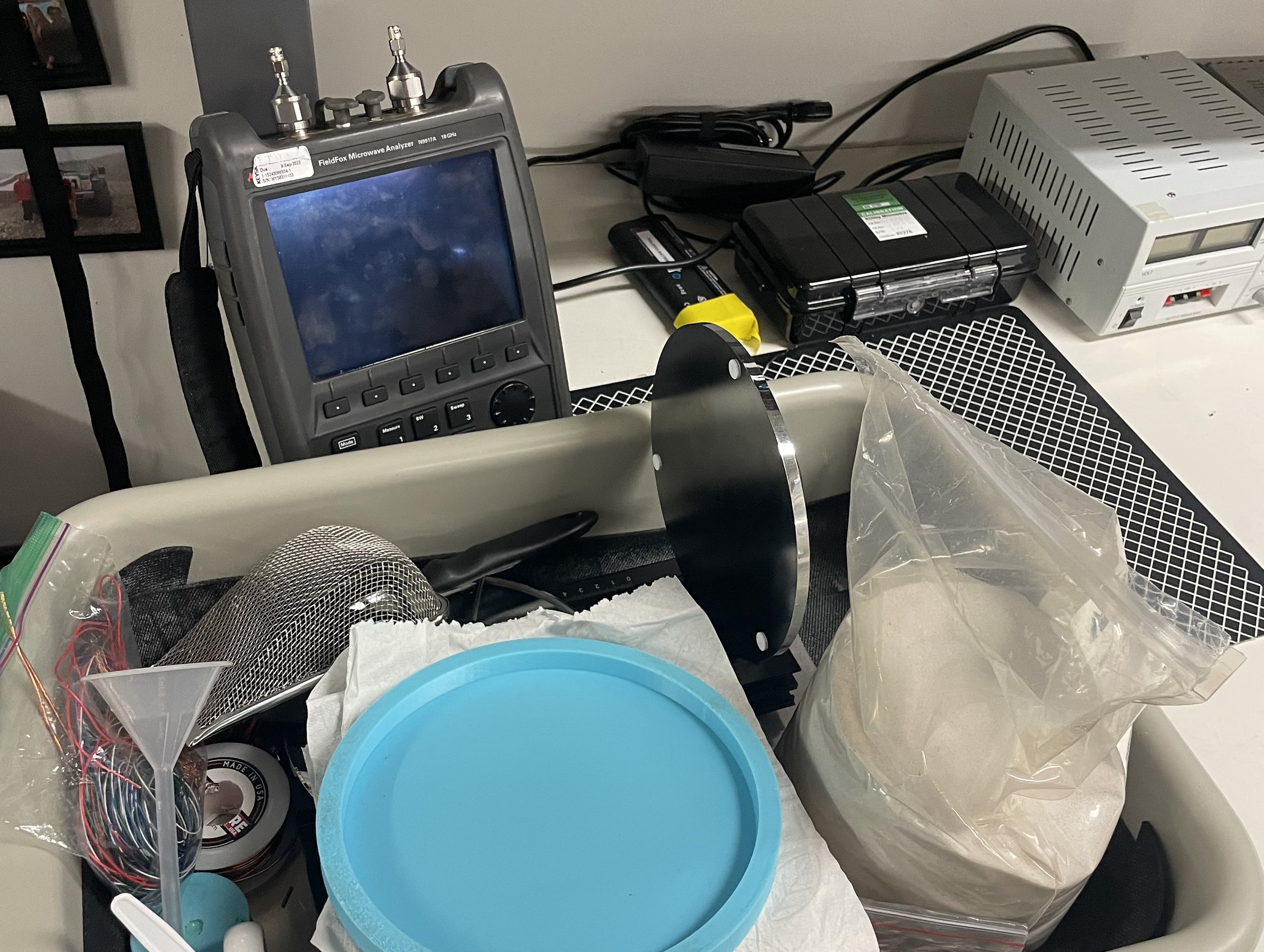 The FieldFox vector network analyzer on the lab bench, behind the sample supplies